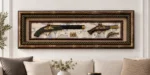 Antique pistol shadowbox wall art with ornate frame, displayed above a sofa.