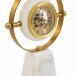 Brass skeleton clock with marble base, modern luxury home decor accessory.