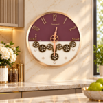 Elegant plum and gold wall clock with gear design in a modern kitchen setting.