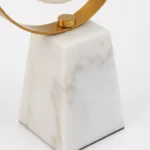 Gold ring clock with marble base, modern luxury home decor accessory.