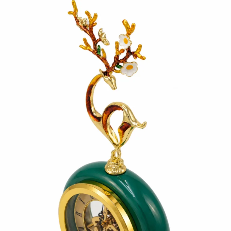 Ornate emerald clock with floral finial, luxury home decor accessory.