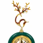 Ornate gold branch clock with floral finial, modern luxury home decor accessory.