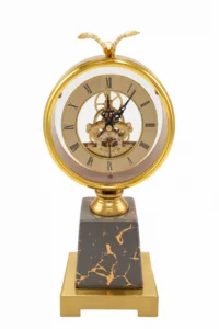Ornate gold skeleton clock with marble base, luxury home decor