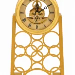 Ornate gold skeleton mantel clock with intricate design, modern home decor accessory.
